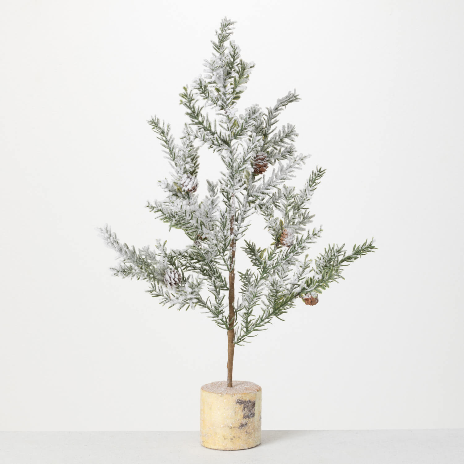 SNOWY PINE TREE WITH PINECONES